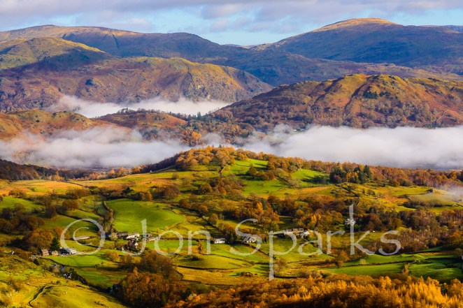 Loughrigg Fell is in the middle ground, with mist both in front and behind